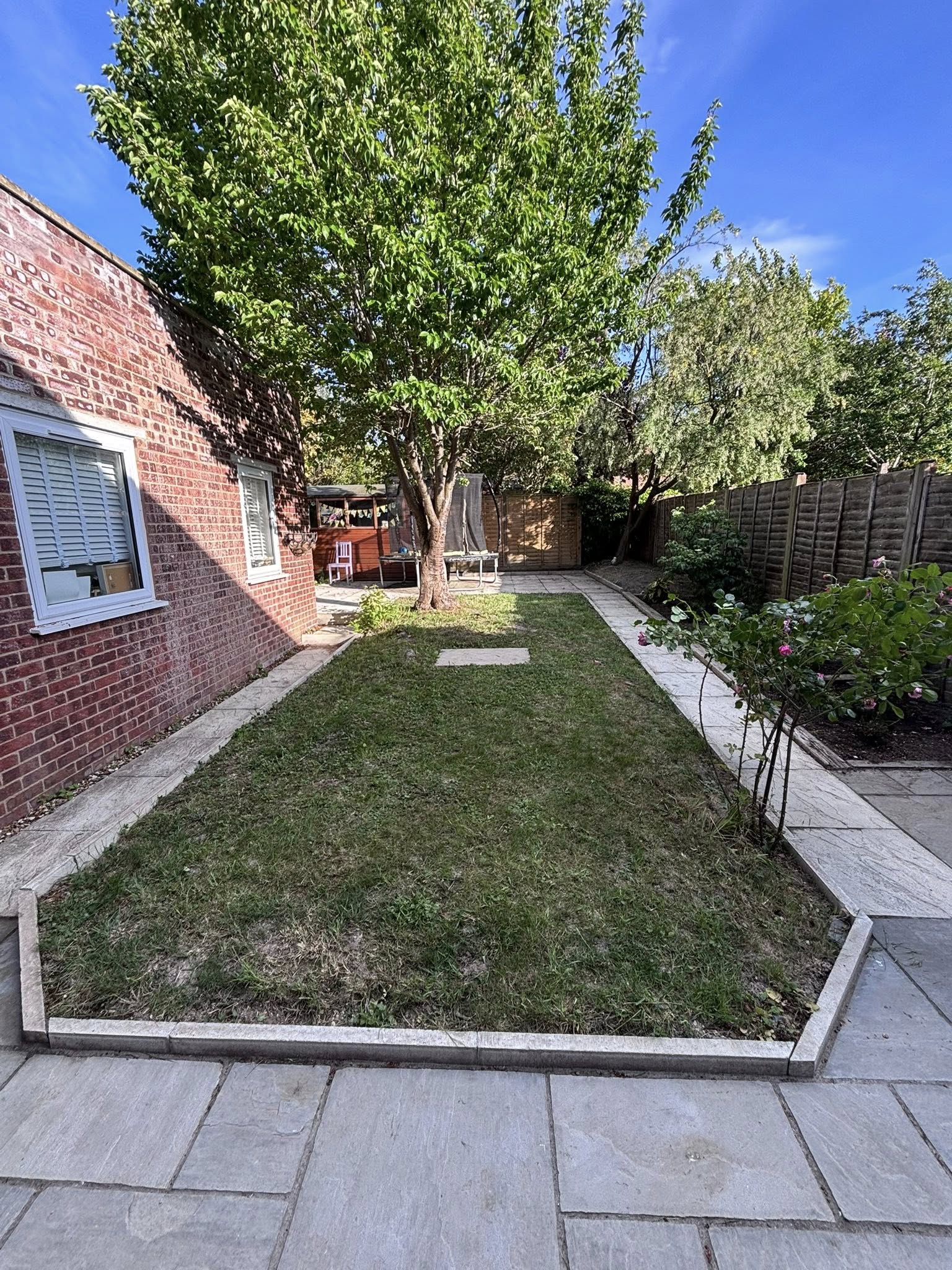 Immaculate garden lawn maintained by L&J Gardening